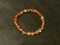 Orange Bracelet with Glitter and Gold Spacers (7.5)