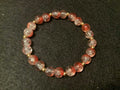 Orange Bracelet with Glitter and Gold Spacers (7.5)